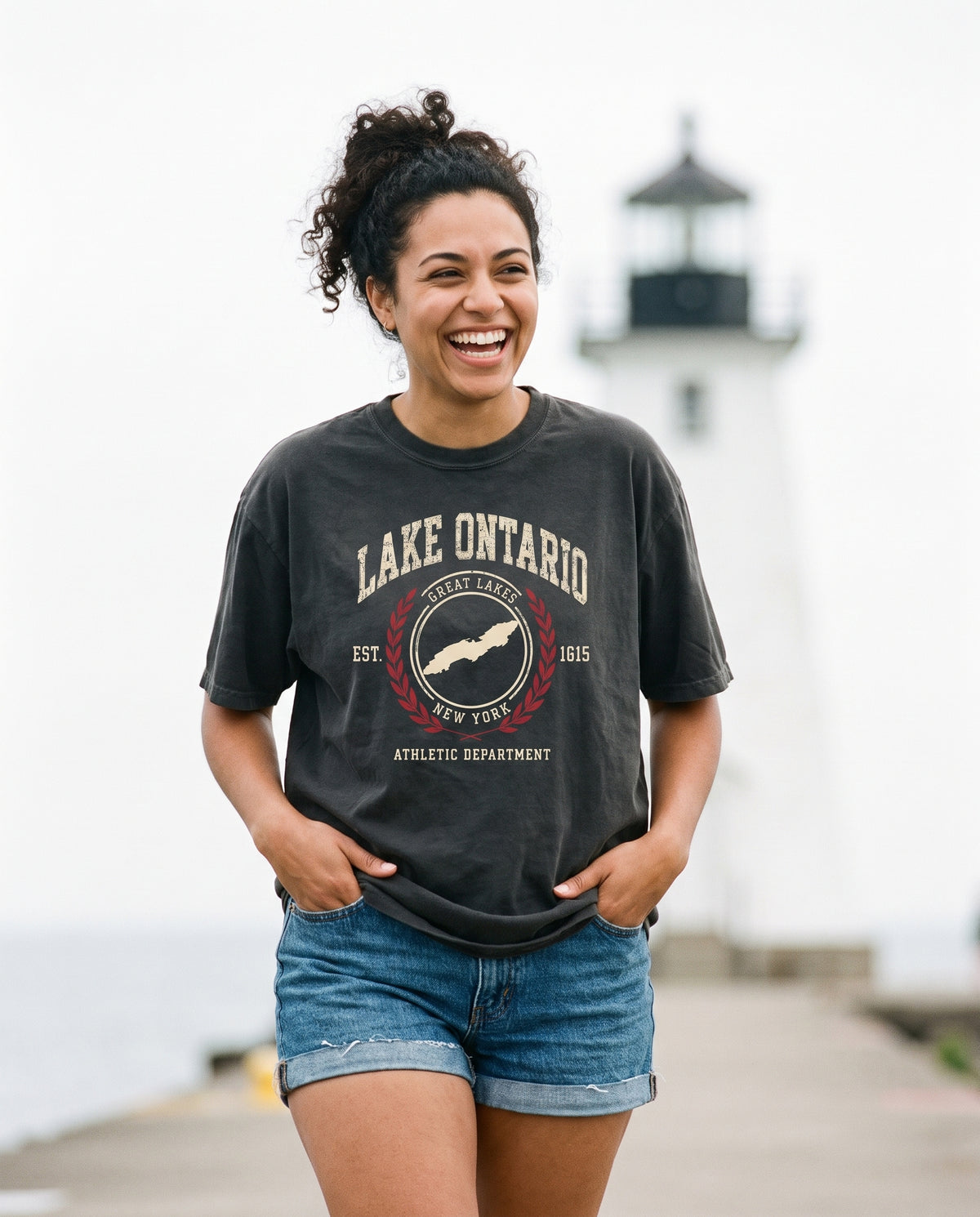 Lake Ontario Athletic Department tee in Black, on the Sodus Point pier
