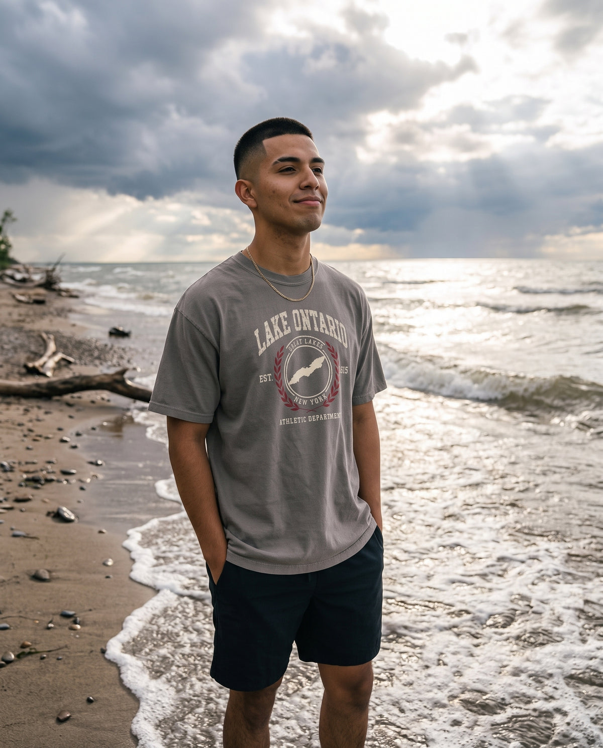 Lake Ontario Athletic Department tee in Grey, standing in the surf
