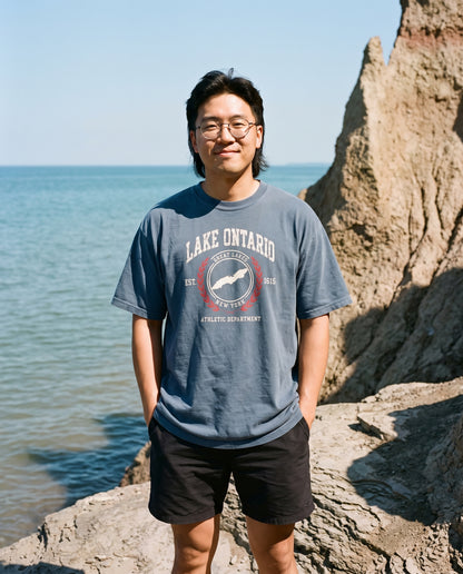 Lake Ontario Athletic Department tee in Indigo, at the base of Chimney Bluffs