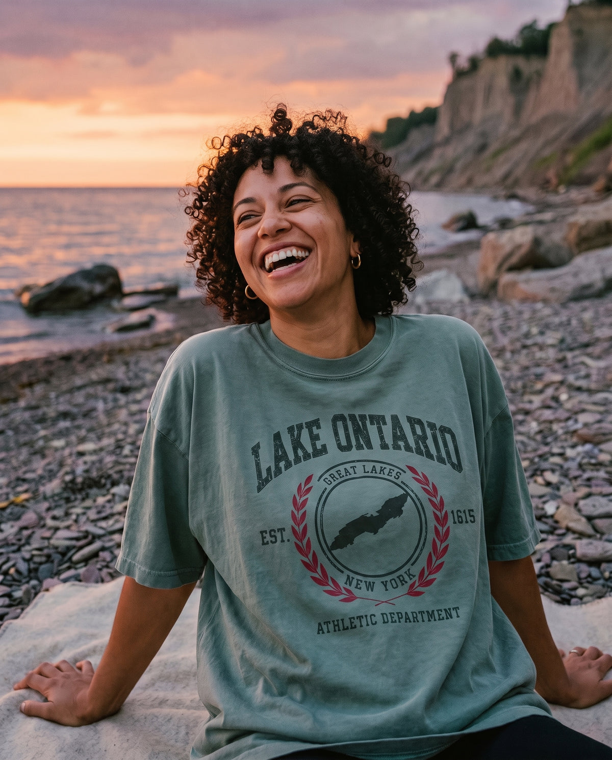 Athletic Dept Tee in Eucalyptus, worn on the shore of Lake Ontario