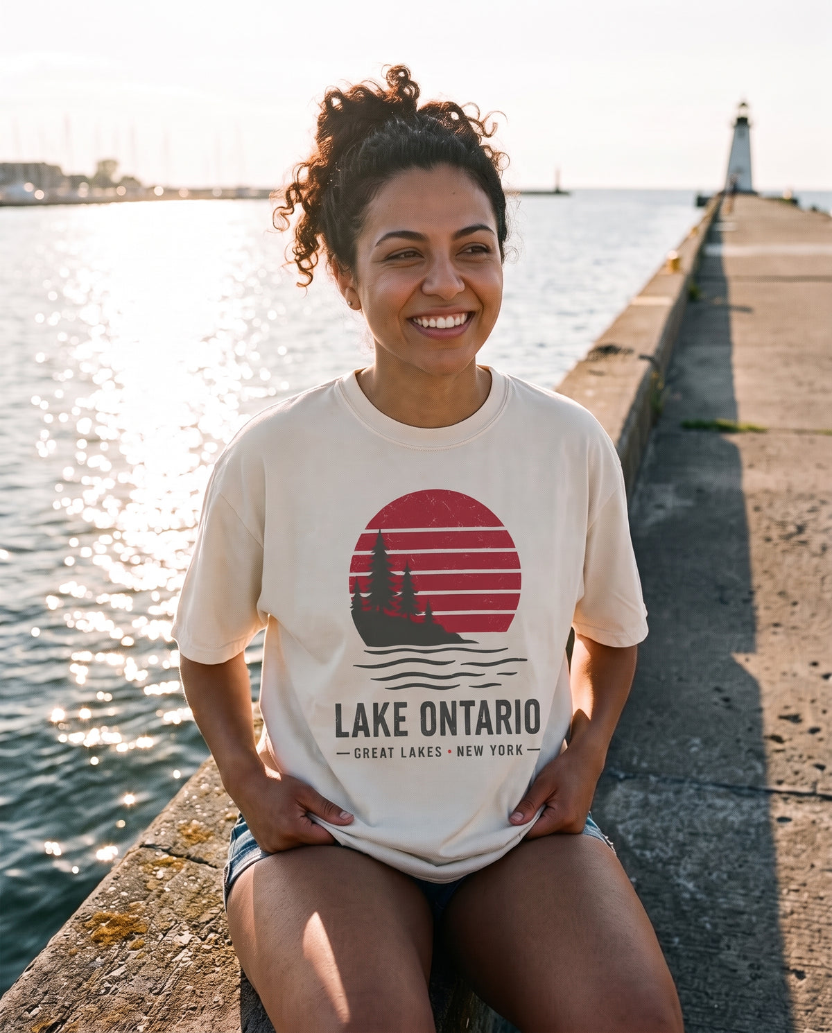 Lake Ontario Sunset Tee in Faded Bone on the Sodus Point pier